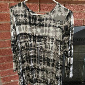 A black and white mid sleeve top made of 85% rayon - very soft